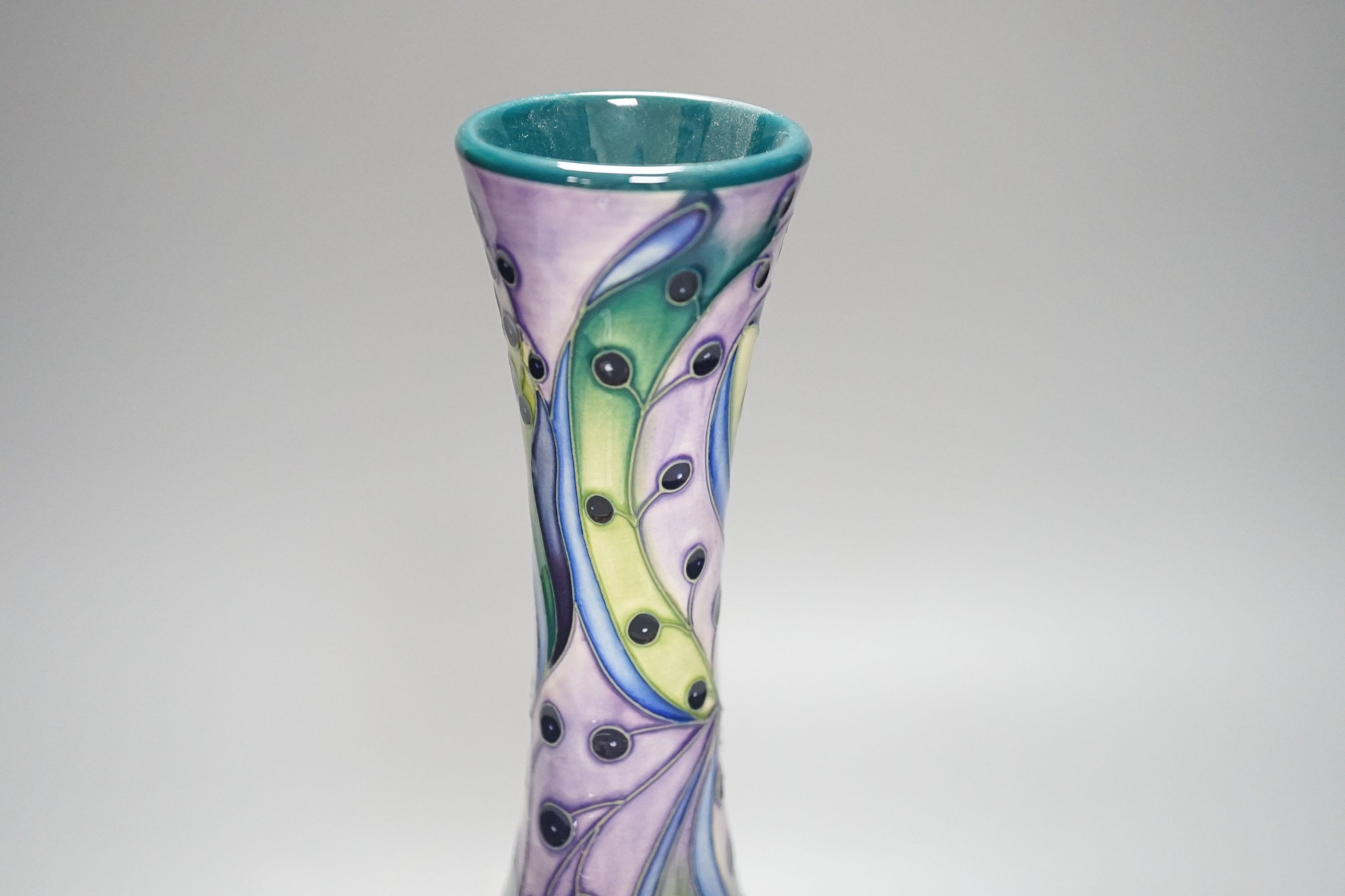 A Moorcroft bottle vase, stylised berries 31cm